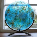 Gaia, fused glass disc, forged steel stand