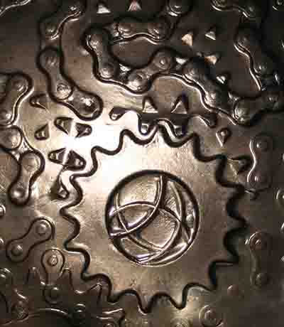 Backlit cast of cycle chain and sprockets