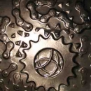 Backlit cast of cycle chain and sprockets