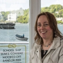 Jayne Ford in front of her Conway Window, Bangor