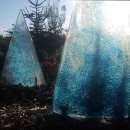 Cast glass bowed triangles in sunlight
